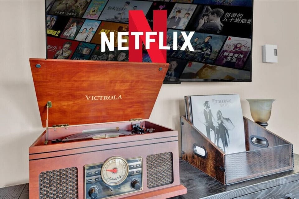 Set the mood with some classic tunes on the vintage record player, adding a touch of nostalgia and charm to the living room.