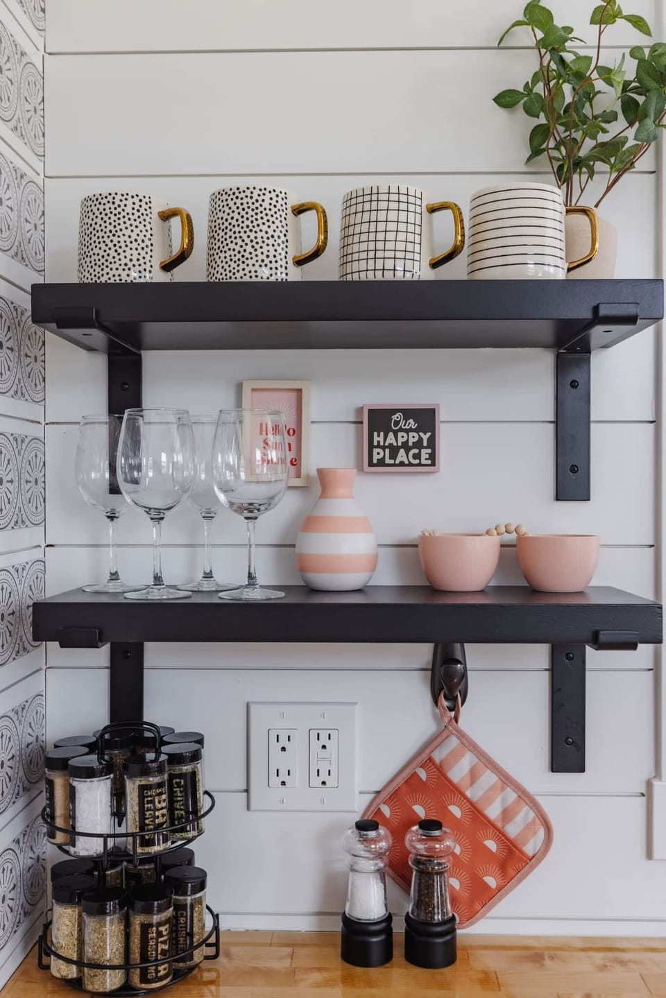 Cozy coffee station with mugs, wine glasses, spices, and thoughtful kitchen essentials for your Southern Utah getaway. Modern farmhouse decor and warm finishes create an inviting tiny home atmosphere.