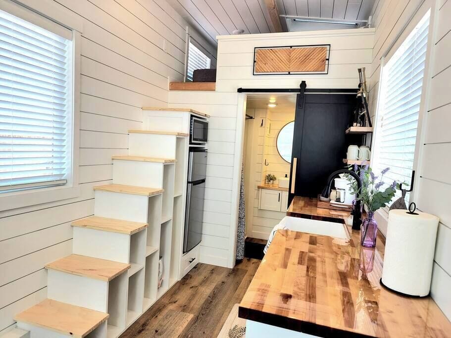 Climb up the stairs to your queen-sized loft, where you can fall asleep stargazing through the loft’s skylights