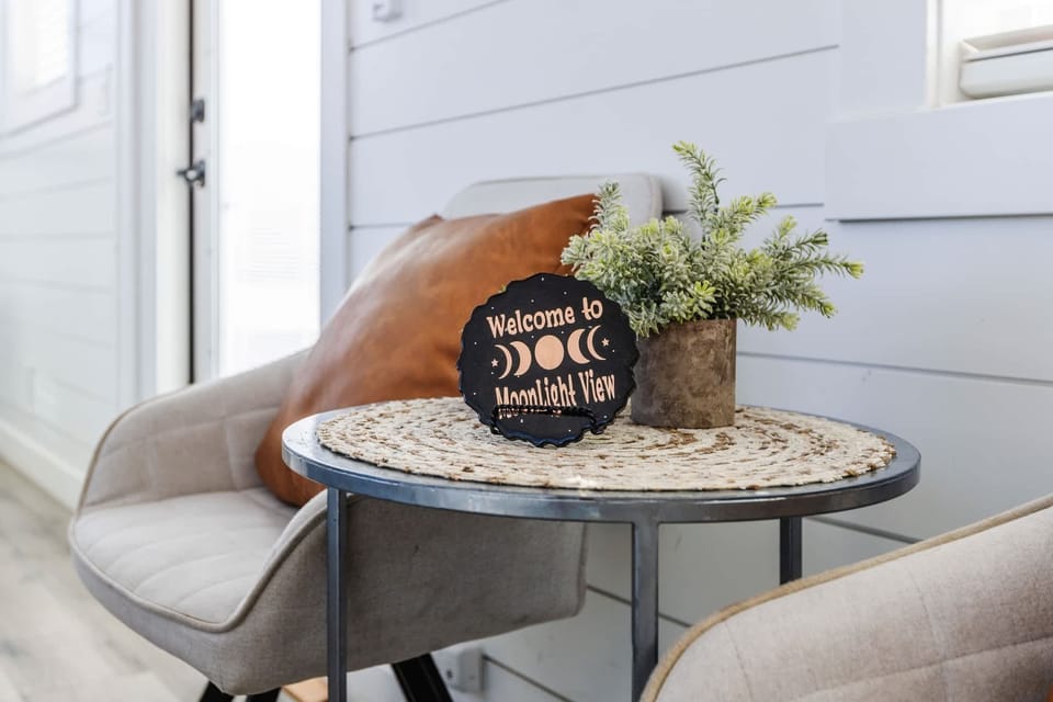 Inviting living space with comfortable seating and sofa bed option, perfect for relaxing after hiking Zion. Thoughtfully designed with modern décor and natural light.