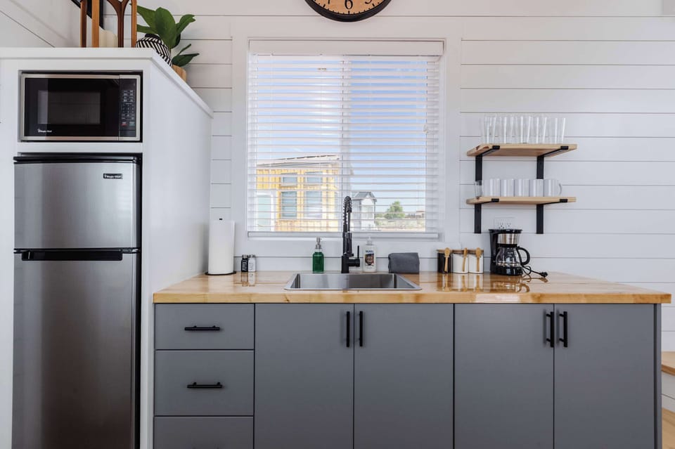 Enjoy a well-equipped kitchen with a deep sink, butcher block counters, open shelving, and a convenient coffee station to start each day before your Southern Utah adventures.