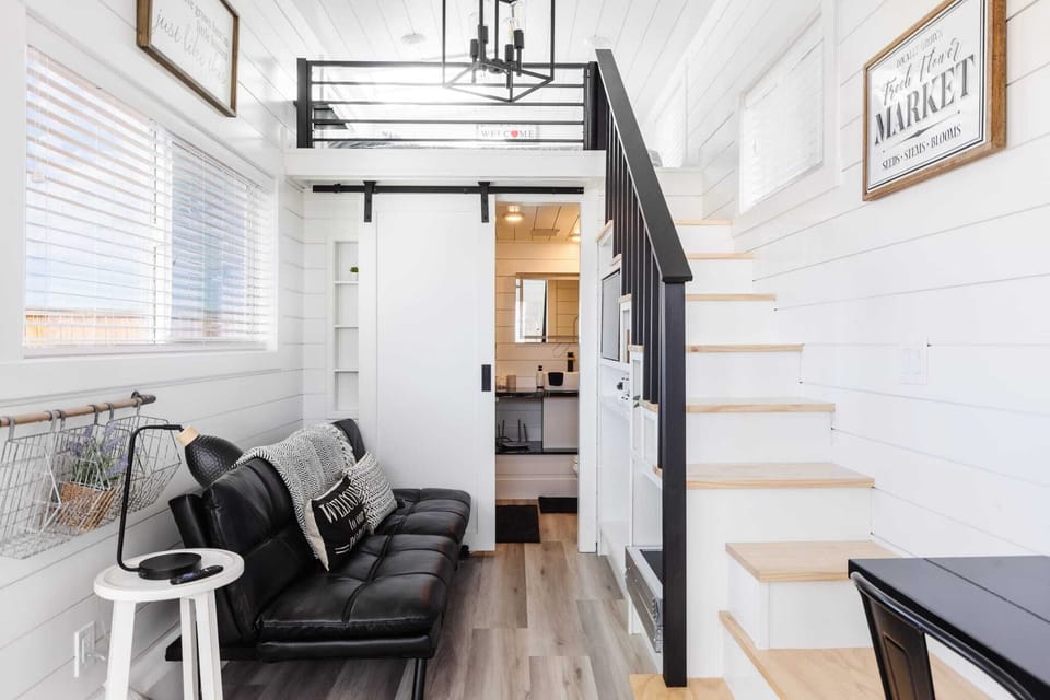 Relax in the inviting living room featuring a comfortable couch, a sofa bed for extra sleeping space, a cozy fireplace, and a TV. With Wi-Fi access, it’s the perfect spot to unwind or enjoy your favorite shows and movies in comfort.