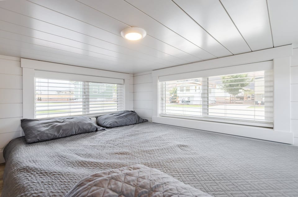 Enjoy a restful night on a comfortable queen-sized bed with soft, crisp linens. The plush mattress provides the perfect balance of support and comfort, ensuring you wake up refreshed and ready to take on the day.