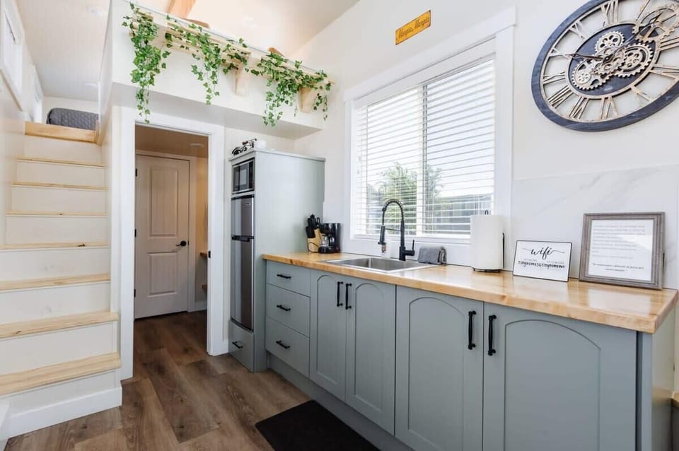 The kitchen is fully equipped with a refrigerator, freezer, microwave, cook-top and sink with hot/cold water. Enjoy coffee from the coffee maker, and find ample counter space, cookware, and storage for all your meal prep needs.