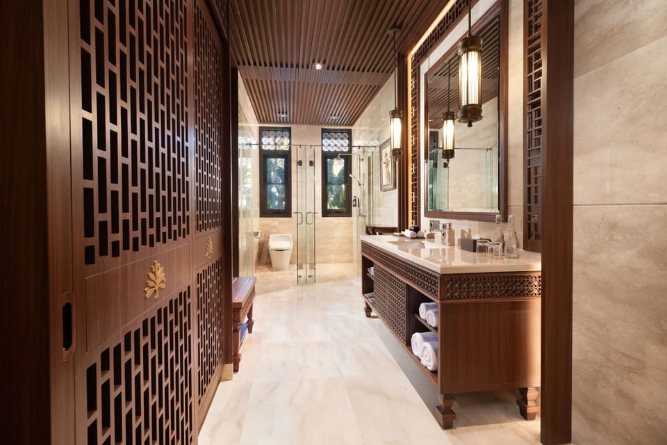 Separate tub and shower, hair dryer, slippers, towels