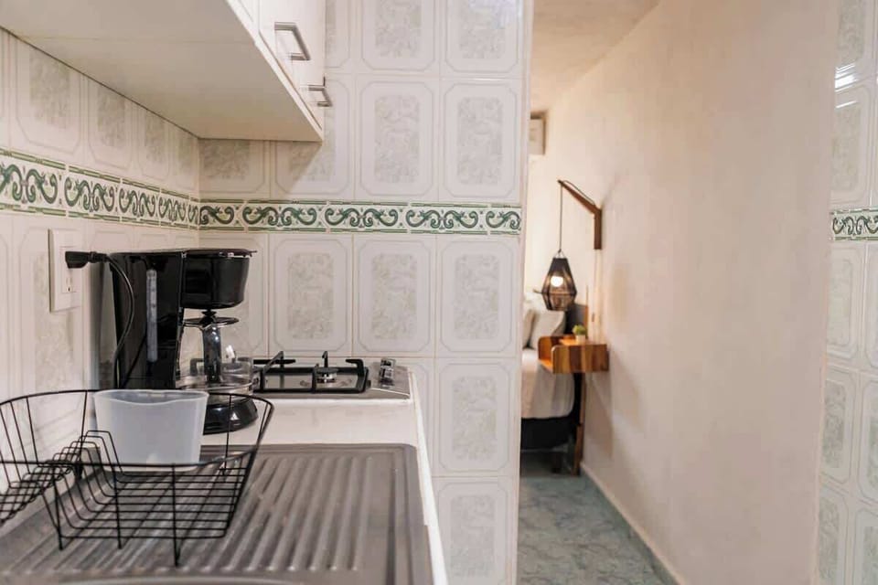 Kitchen area with stove and refrigerator