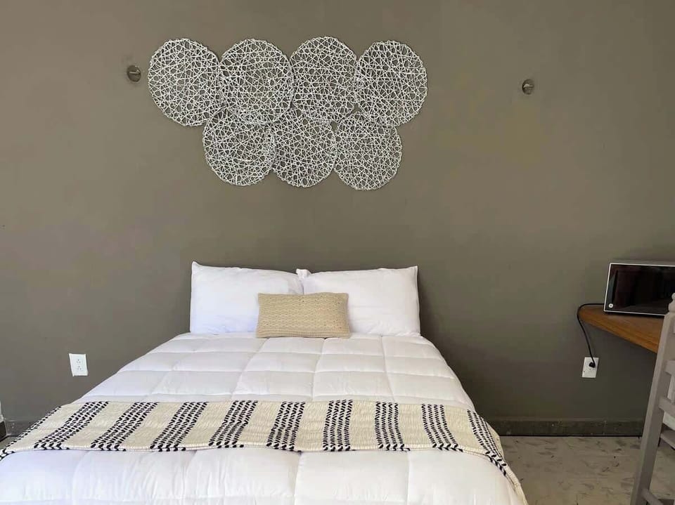 Bed with quality linens and decorative runner