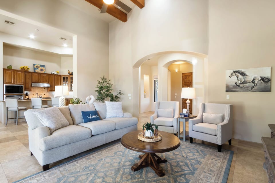Living Room with Open Layout, Vaulted Ceilings, & Backyard Access