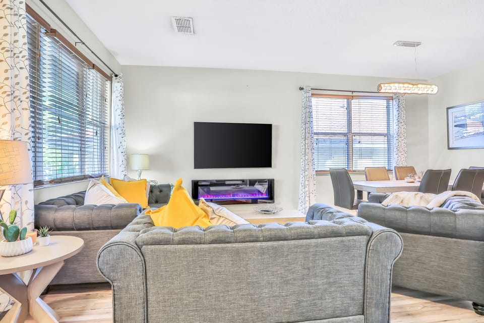1st floor entry seating area with TV & electric fire place