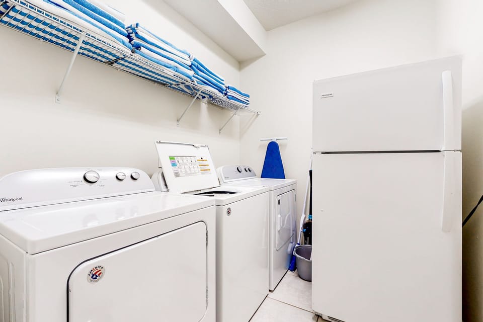 1st floor laundry room with 1 washer & 2 dryers