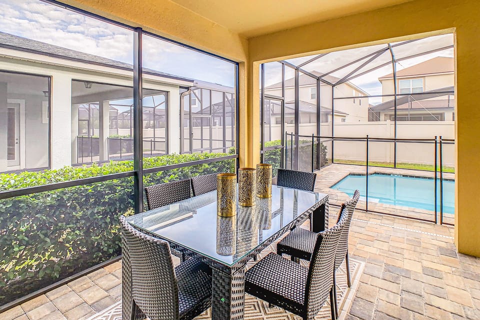 Covered outdoor dining area with seating for 6