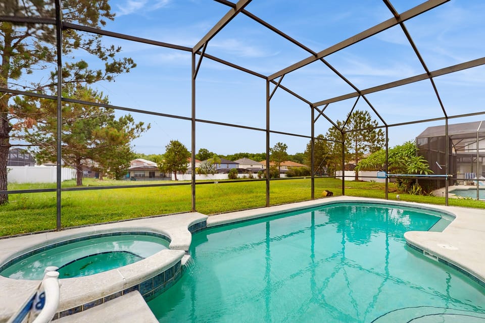 Lanai with private pool & spa, small dining area, lounging area & 3 sun loungers