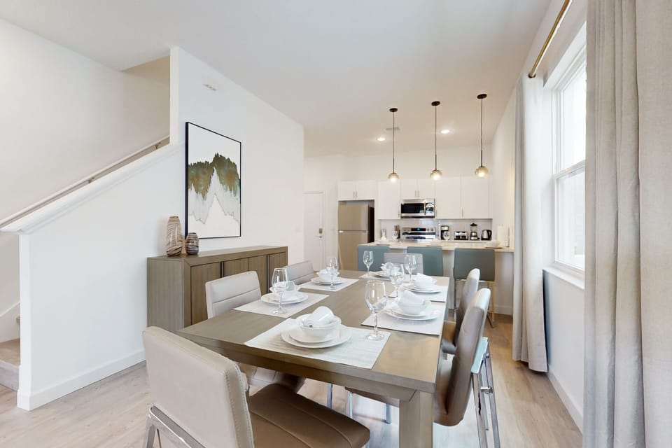 The dining area and kitchen seamlessly blend into one cohesive space.