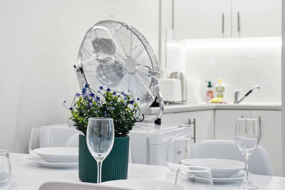 Stylish dining setup with neatly arranged tableware and decorative touches.