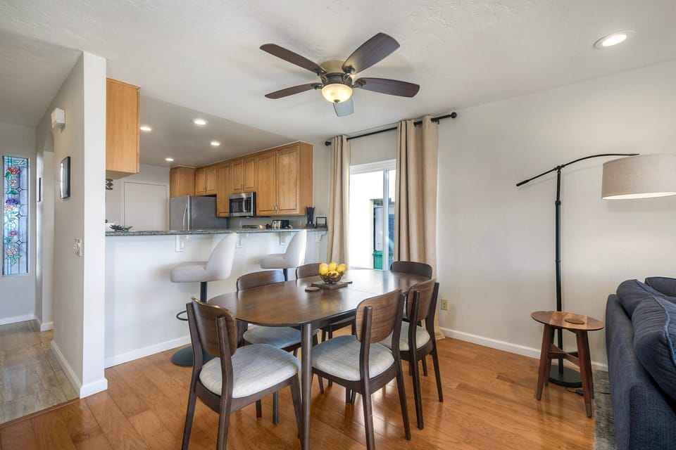 Spacious dining area beside modern breakfast bar.
