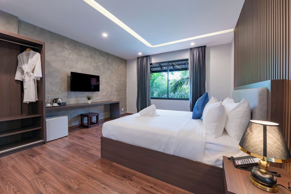 Family Triple Room, Pool View | Down comforters, in-room safe, individually decorated, desk