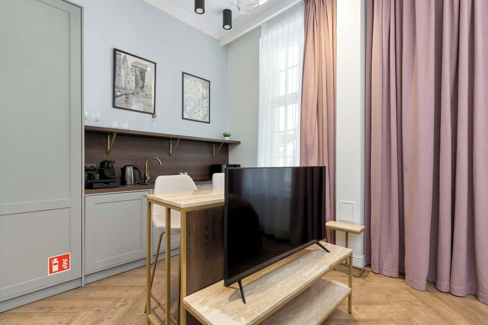 Small living area with TV and dining table.