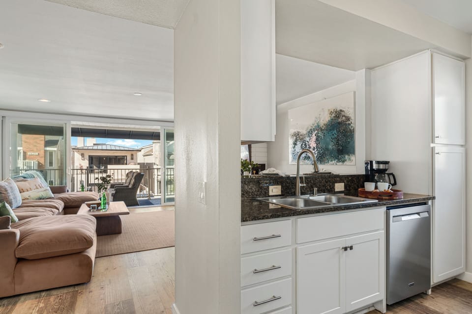 Fully equipped kitchen with bar seating, ideal for cooking, dining, and gathering.
