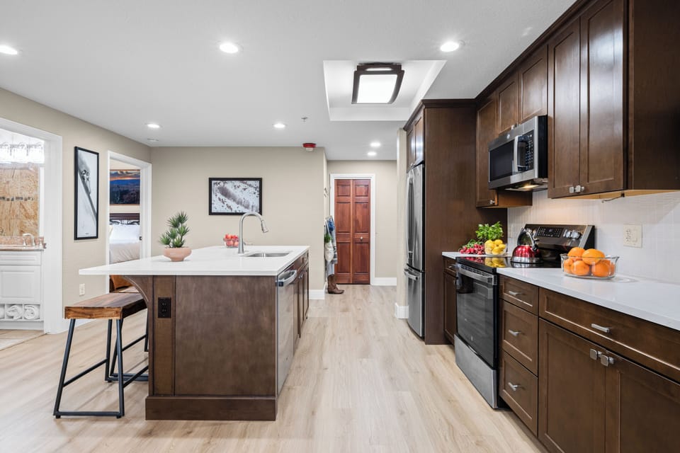 Fully equipped kitchen with sleek appliances, a spacious island for casual dining, and plenty of counter space for easy meal prep.