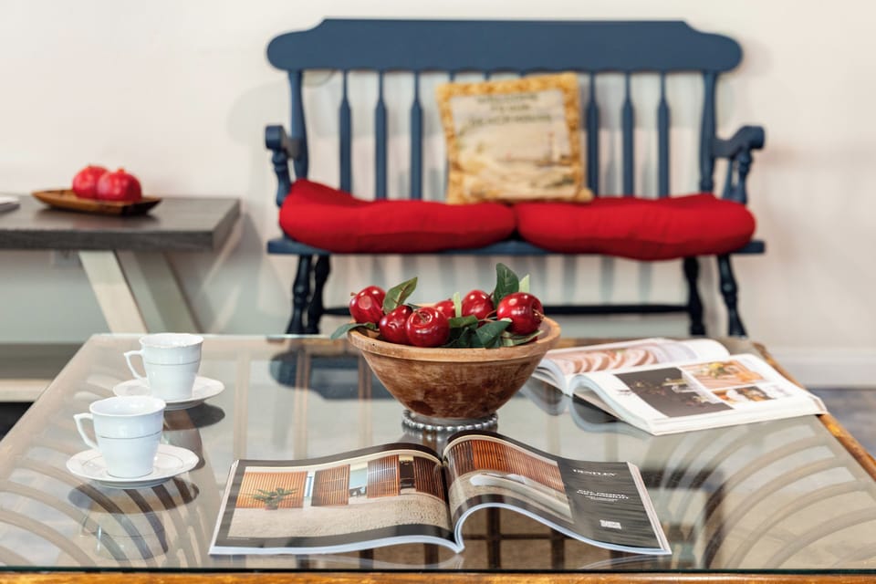 Cozy seating area with a glass coffee table and charming coastal accents.