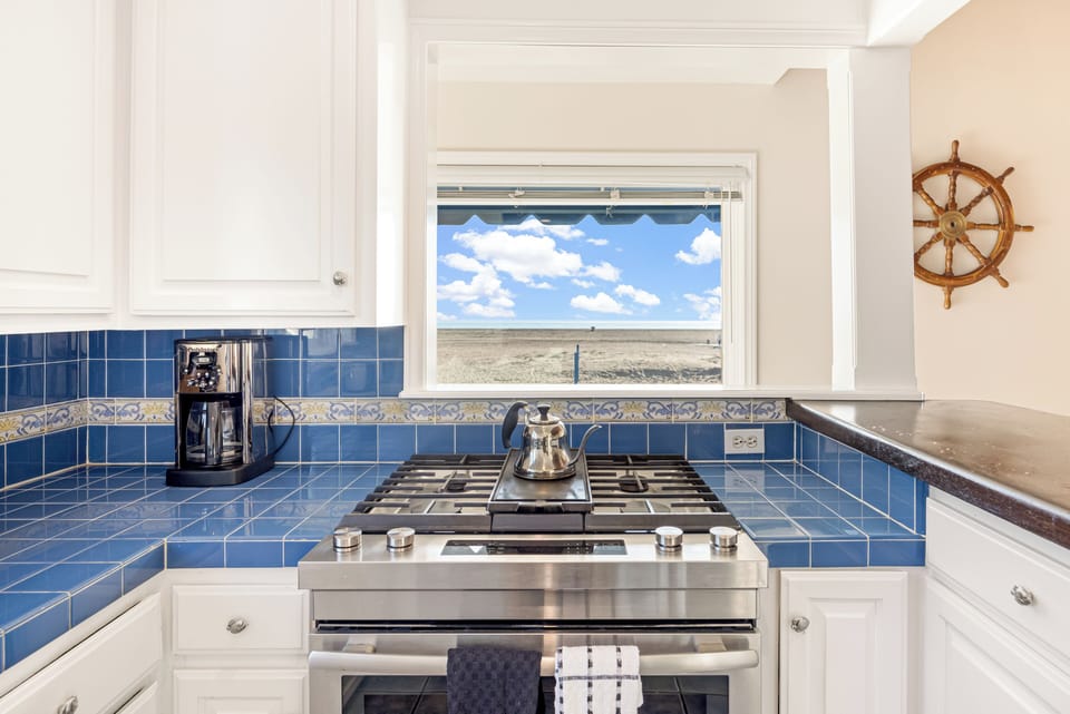 Fully equipped kitchen with reliable appliances and ocean views.