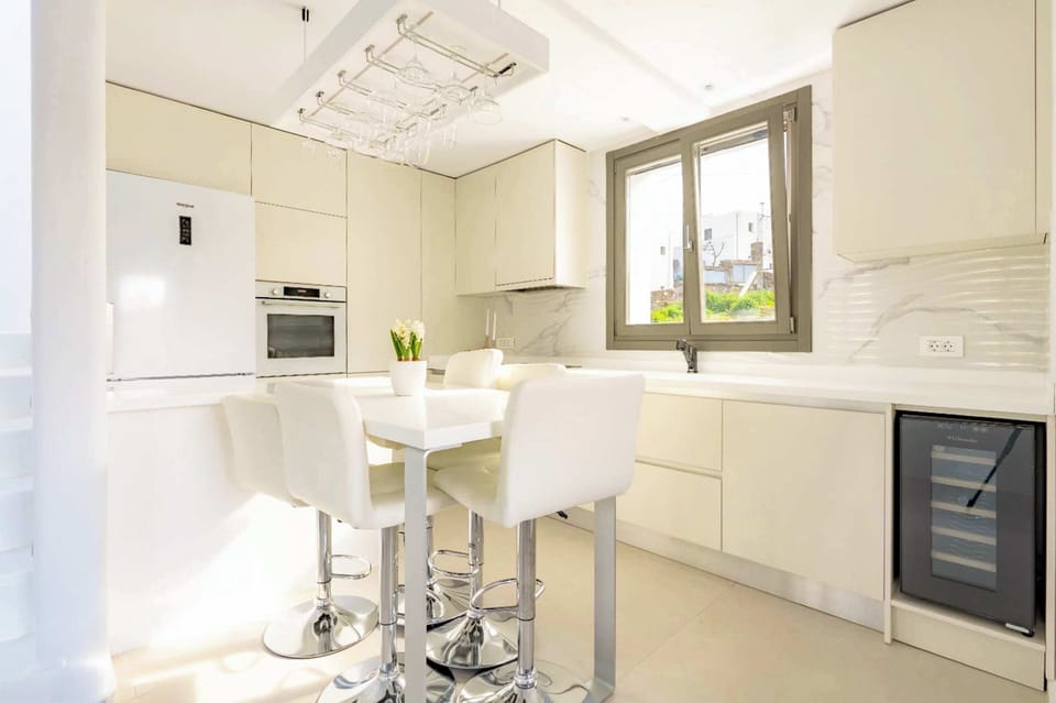 Minimalist white Kitchen with serene island ambiance