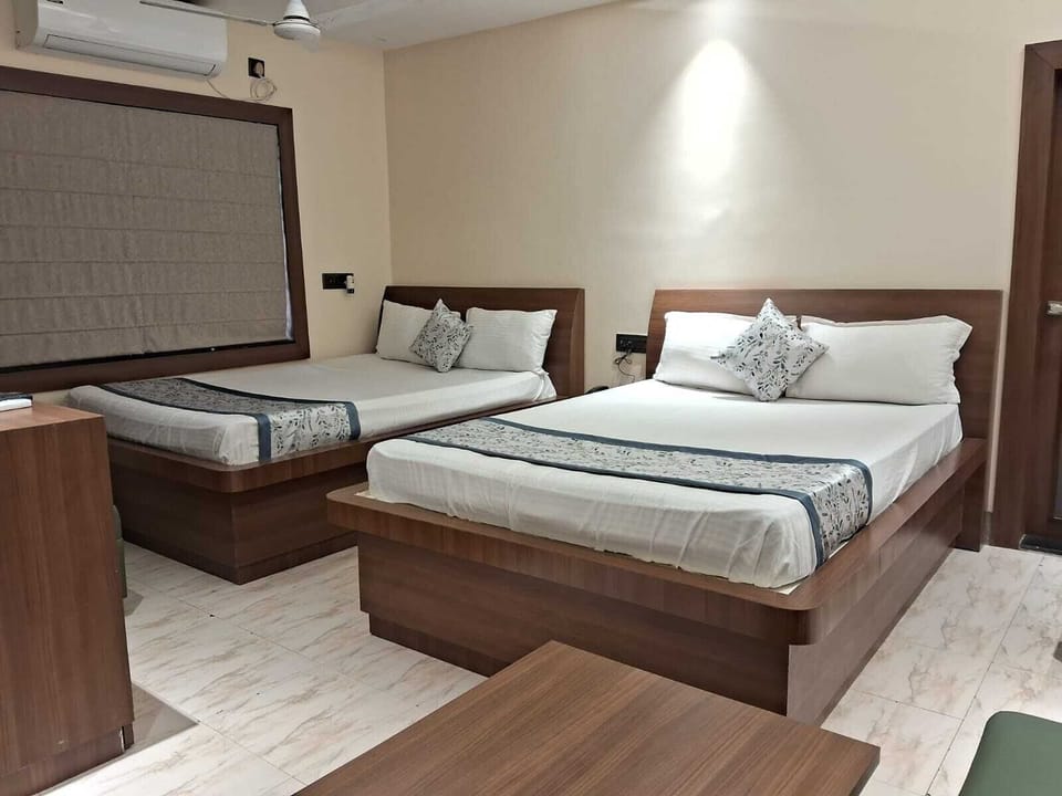 Deluxe Quadruple Room, Balcony, City View | Desk, free WiFi
