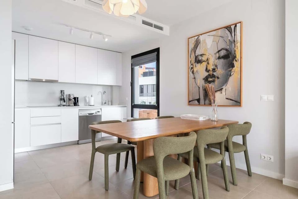 Dining area with a table and chairs, perfect for enjoying meals together.