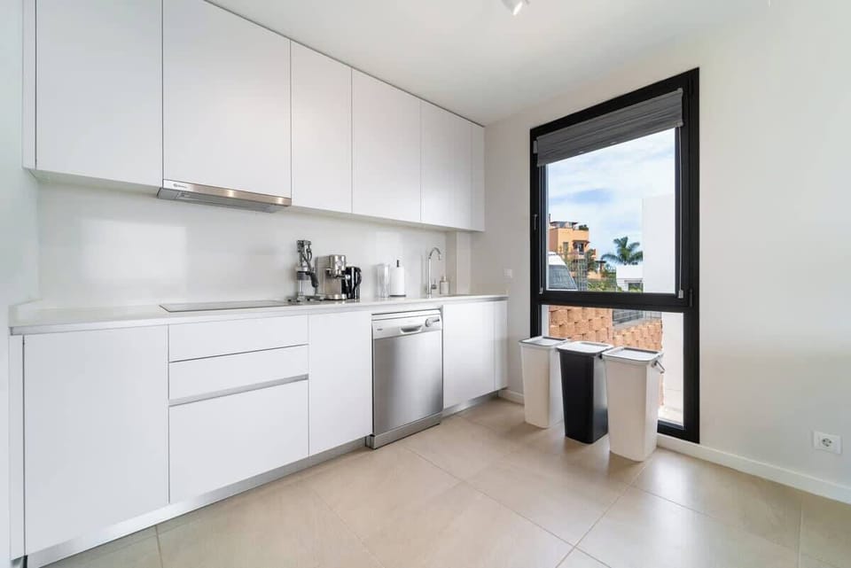 Modern kitchen with appliances and utensils for convenient cooking.