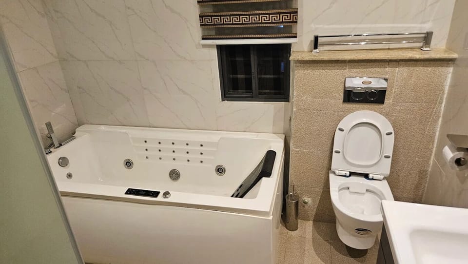 Family Room, Balcony, City View | Bathroom | Free toiletries, hair dryer, towels, soap