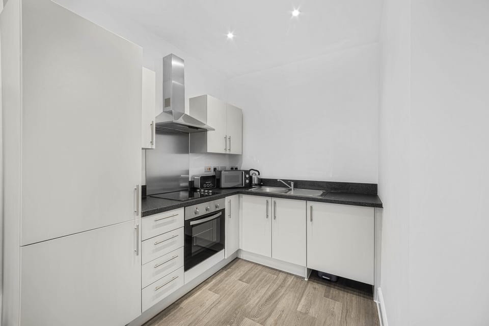 Apartment (Two-Bedroom Apartment) | Private kitchen | Electric kettle, dining tables