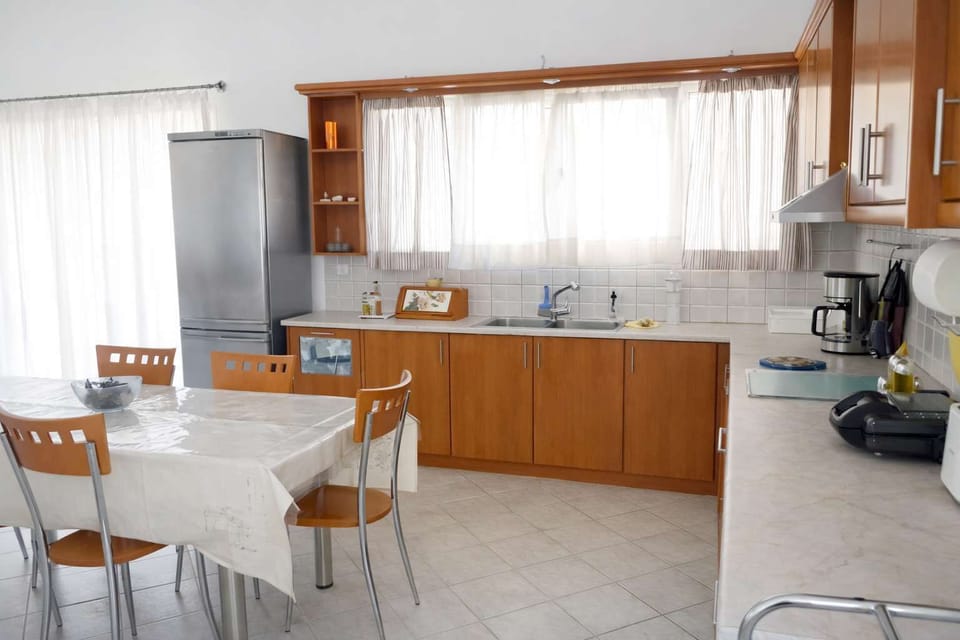 Kitchen & Dining Area with Natural Light
Comfortable layout ideal for shared meals.