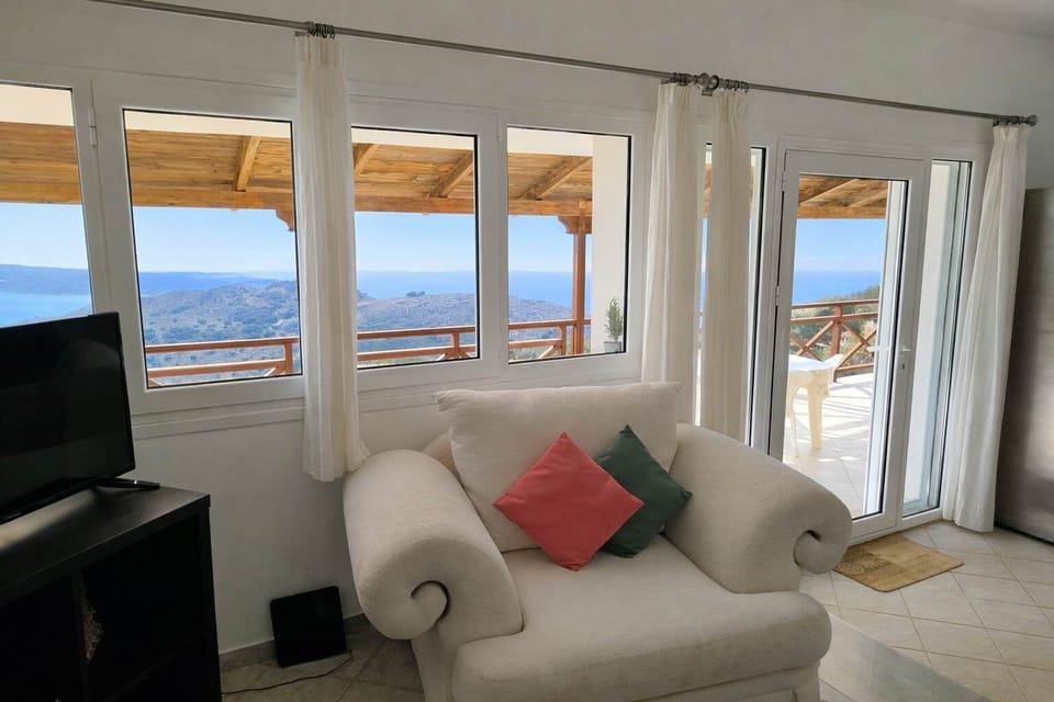 Living Room with Expansive Windows & Sea Views
Comfortable lounge area overlooking the coastline.