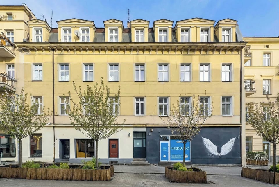 Historic building exterior where the apartment is located, set along a charming pedestrian street.
