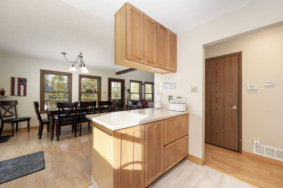 Your bright kitchen island at 874 Kinnikinnick Road overlooks the dining area, perfect for meal prep while chatting with family and friends.