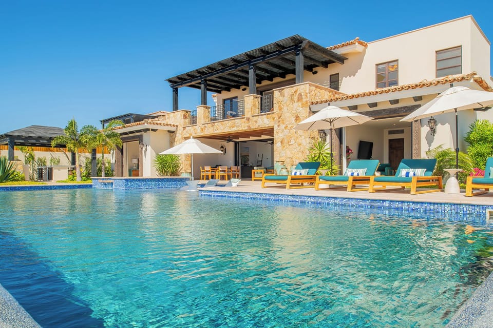Stunning villa with pristine pool and elegant outdoor lounging areas for your perfect getaway retreat.
