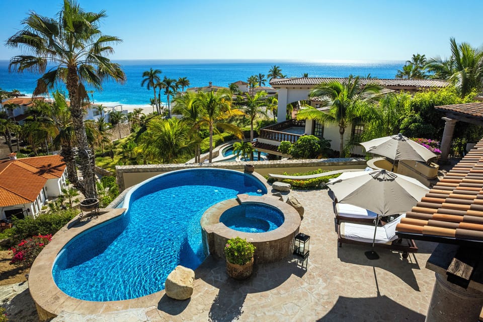 Patio with pool and jacuzzi with beach views