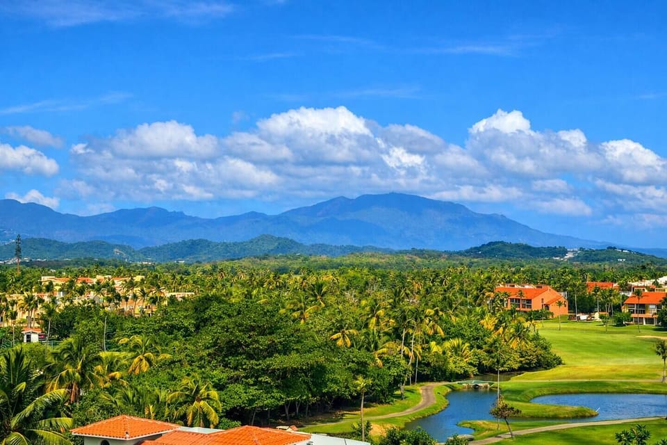 Sweeping El Yunque rainforest and golf course views from your private terrace.