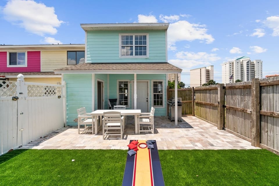 Fenced in back yard area with seating and plenty of room for fun (and pets)
