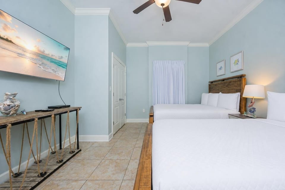 Unwind in this queen guest suite and stream your favorite shows or enjoy a good movie after a beach day