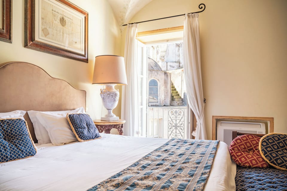 Deluxe Suite, City View | Blackout drapes, iron/ironing board, free WiFi, bed sheets