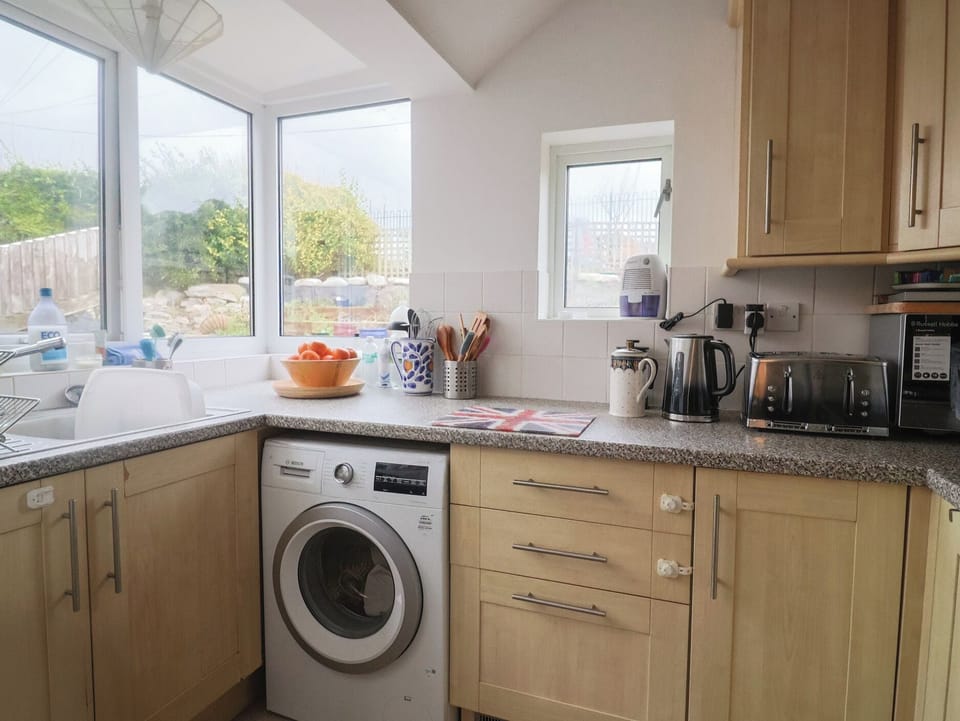 Fridge, microwave, toaster, cookware/dishes/utensils