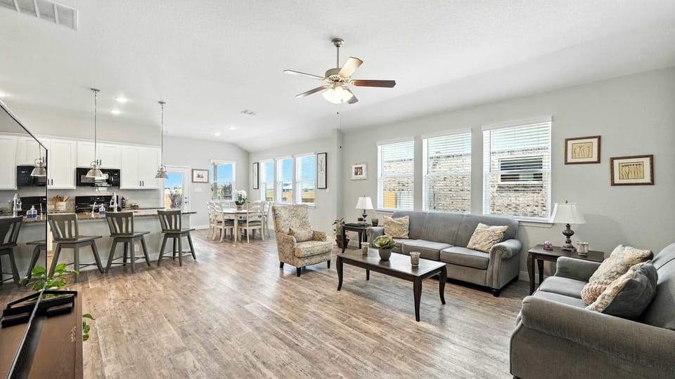 Open-concept living, dining, and kitchen area made for easy living, good conversations, and everyday comfort.