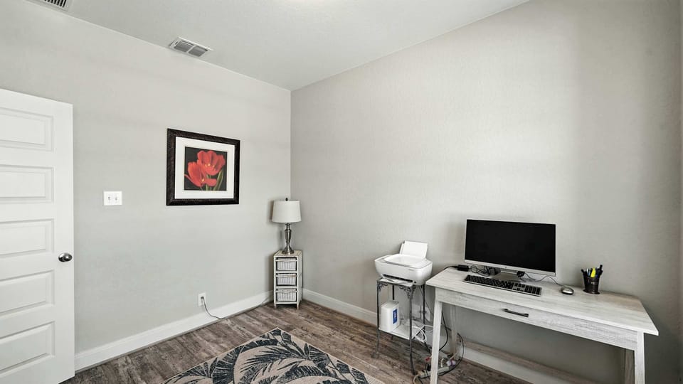 Private flex room set up as a home office, ideal for remote workers or anyone needing a quiet space.