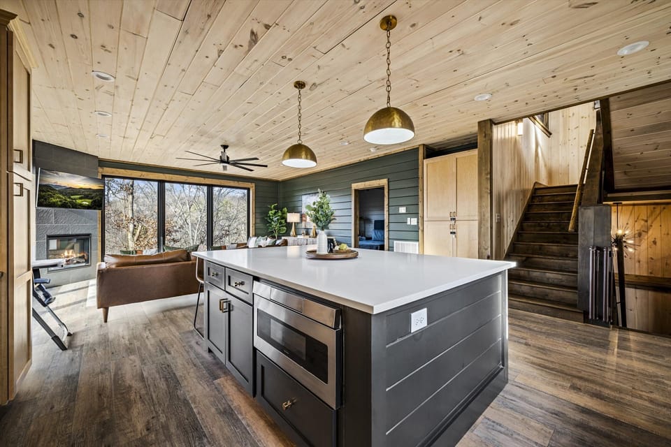  This forest-view retreat blends rustic charm with modern comfort