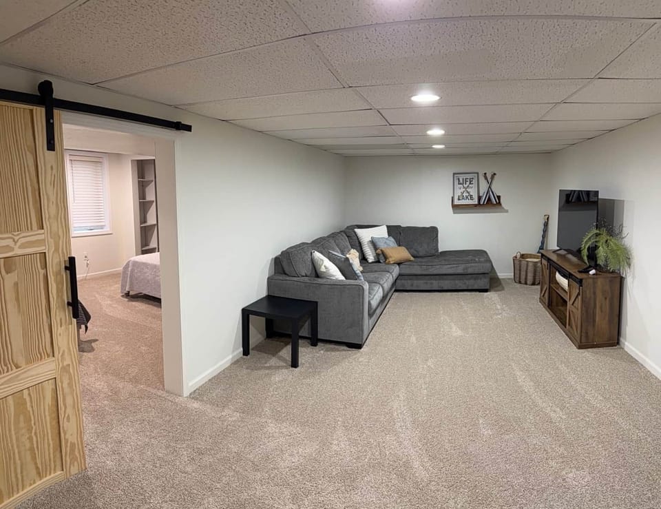 Downstairs living room, with sectional sleeper that pulls out to a queen bed.