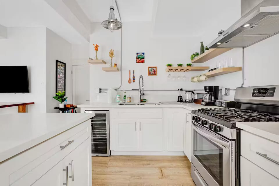 Kitchen -- full range stove and wine cooler
