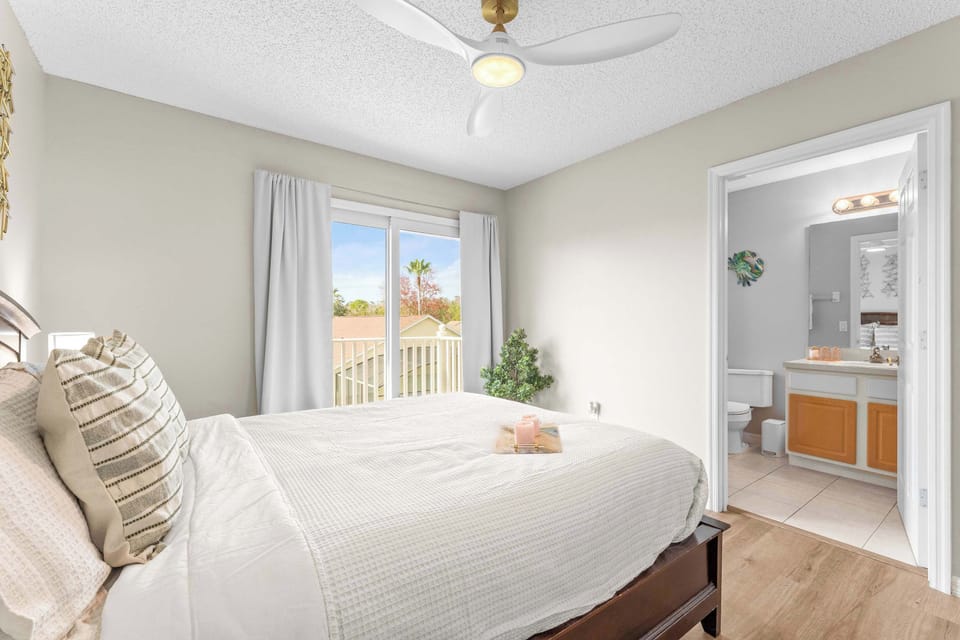 Bedroom 3 with queen bed, balcony, and en-suite 