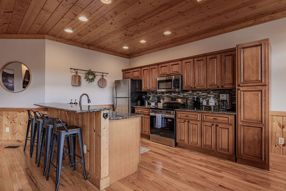 Fully equipped kitchen with additional bar seating! Make family meals and snacks!