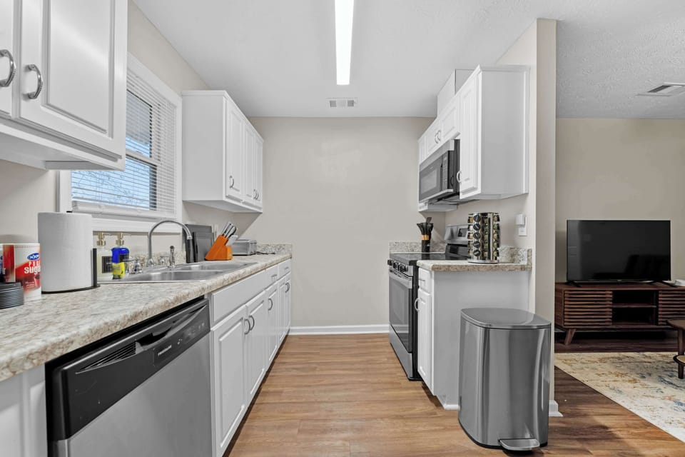 With ample counter space and stainless steel appliances, preparing a home-cooked meal is easy and enjoyable.